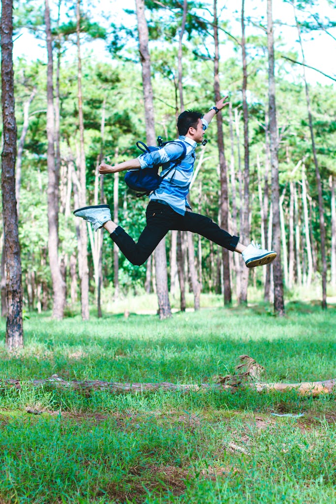 Man Wearing Backpack Jumping Photo
